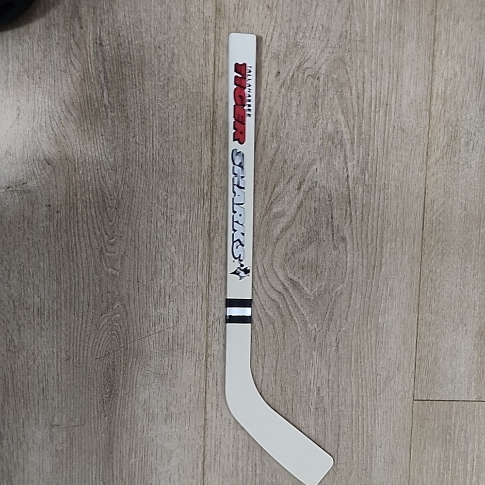 Vintage plastic mini hockey stick of the Tallahassee Tiger Sharks.